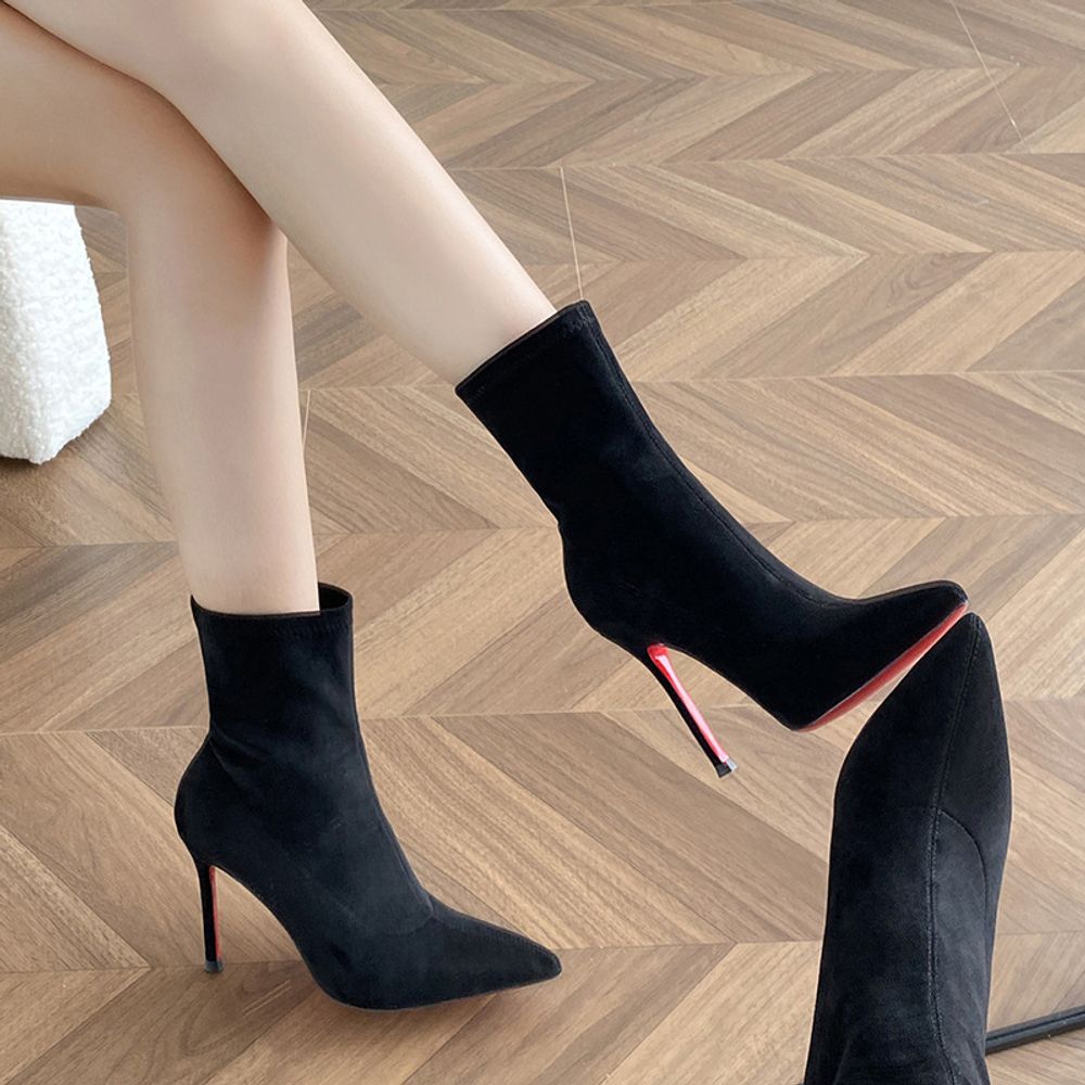 Red-soled high ankle boots