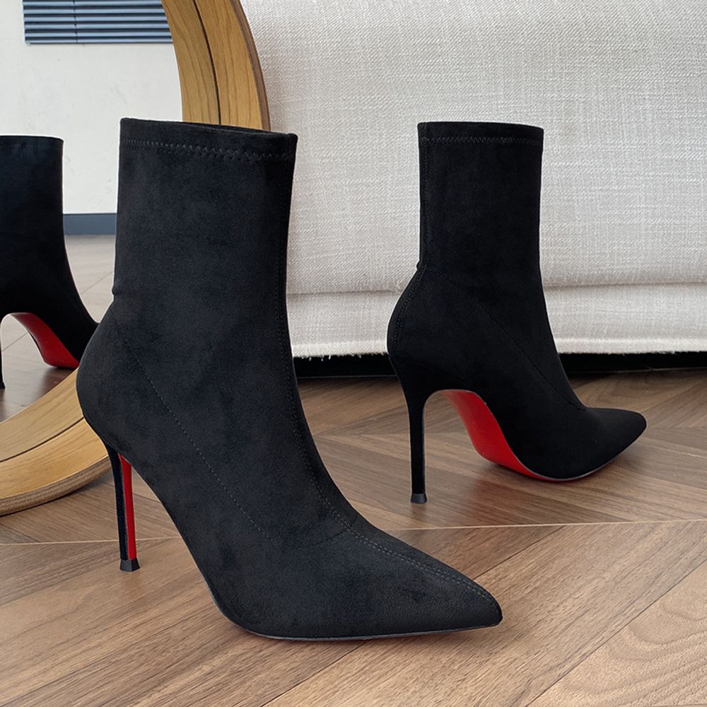 Red-soled high ankle boots