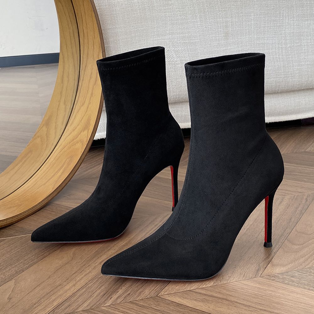 Red-soled high ankle boots